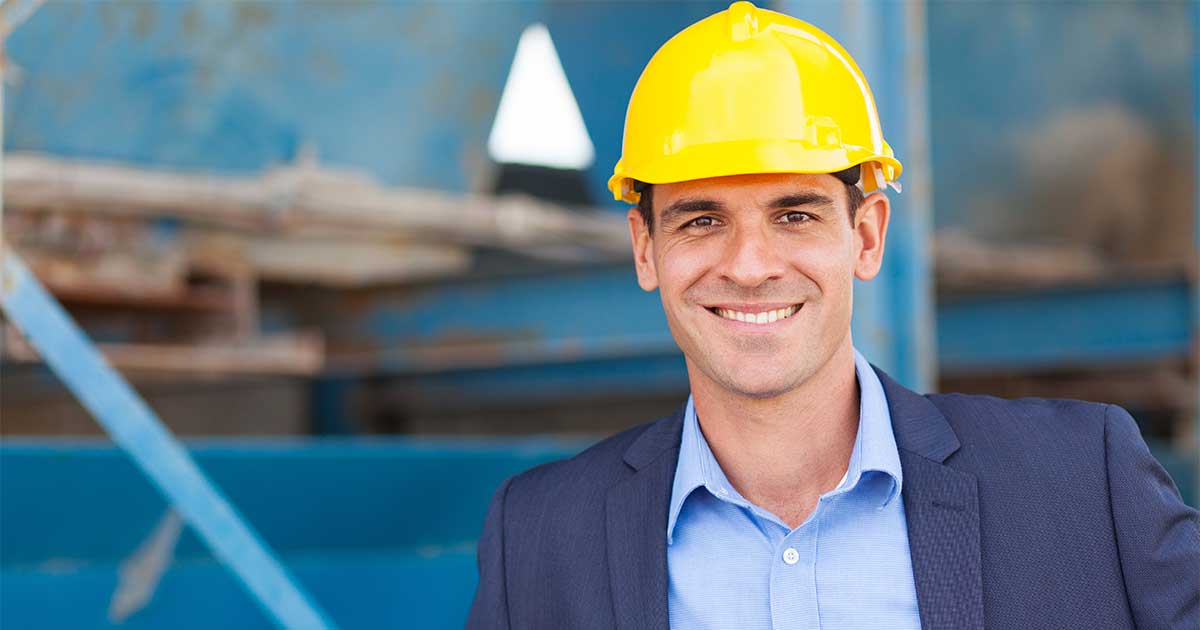 Young business man in a hard hat